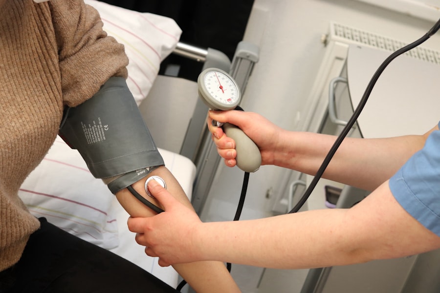 Caregiver checking blood pressure of an elderly client